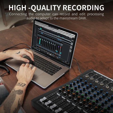Person using laptop with Sixteen Channel Audio Mixer Pro For PC Studio And Live DJ Setup with Bluetooth on desk