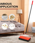 Manual Carpet Floor Sweeper With Tough Horsehair Rollers To Snag Pet Hair And Crumbs Plug Free Unit on a rug under a couch.