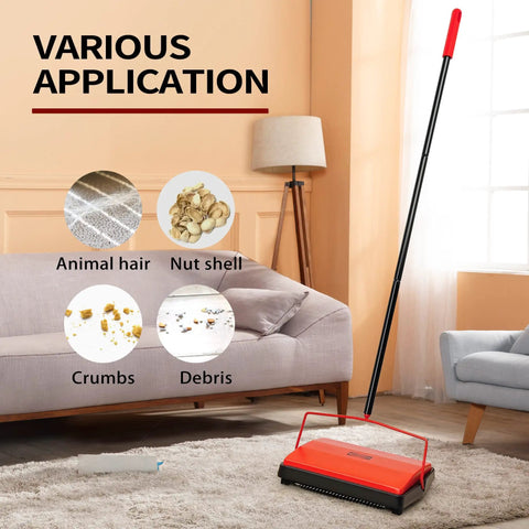 Manual Carpet Floor Sweeper With Tough Horsehair Rollers To Snag Pet Hair And Crumbs Plug Free Unit on a rug under a couch.