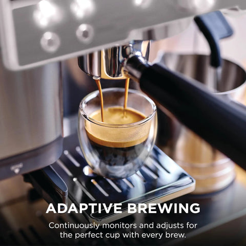 Brew Like A Pro At Home With This Triple Threat Espresso And Drip Coffee Maker Featuring Rapid Cold Brew Options Alongside Reliable Dual Shot Settings In Sleek Gunmetal Finish, brewing espresso shot into glass.