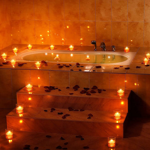 Bathtub surrounded by 48 Piece LED Floating Candles Flameless Waterproof Tealights For Weddings And Pool Parties Centerpieces Yellow Warm White Light Create Romantic Vibe And Dinner Ambiance Battery Powered Tealights For Bathtub.