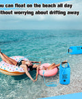 Floating with 2 Pack Sand Anchor Bags 10L And 20L, 2 In 1 Kayak Anchor Kit With Adjustable Straps securing pool floats on the beach