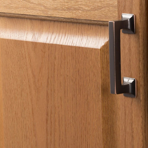 Studio Collection Cabinet Pull Three Inch Center To Center Oil Rubbed Bronze Highlighted Finish on wood cabinet door