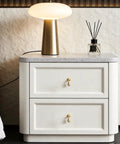 Top Shelf Heavy Duty Solid Brass Cabinet Knob Featuring Slick Brushed Gold Finish Smooth Glide Movement Great For Kitchen Cabinets Dresser Drawers Closet Doors And Vanity Cupboards Elegant Raindrop Pull Handle on white nightstand.