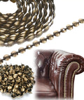 Rock Solid Brass Upholstery Tack Strips 10 Pack 32 Foot Decorative Nail Bands For Couch And Chair Reupholstering snap fit rivets and nails shown with brown leather armchair.