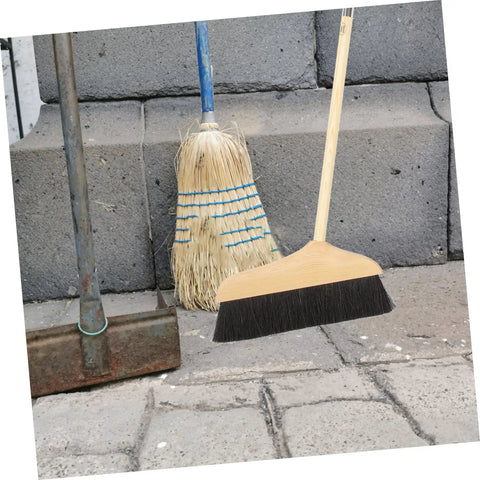 Straight Up Solid Horsehair Broom With Long Grippy Handle And Soft Pine Bristles for sweeping floors next to a straw broom.