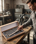 Man examining 23 Piece Flexible Head Ratchet Socket Wrench Set With Heavy Duty CRV Steel All In One Repair Tool Kit in workshop