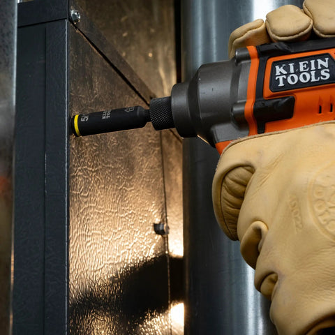 Impact Rated 11-in-1 Multi Bit Screwdriver And Nut Driver With Phillips Slotted Square And Torx Bits in use on metal panel