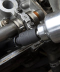 Impact Universal Joint Set, Three Piece For One Quarter Inch, Three Eighth Inch, And One Half Inch Drive, Reaches Tight Angles With Easy Access, Works With Air, Electric Or Battery Tools, Manganese Phosphate Finish, Meets ASME Specs, Model 84969A-07, shown in use with pneumatic tool, reaching engine bolts.