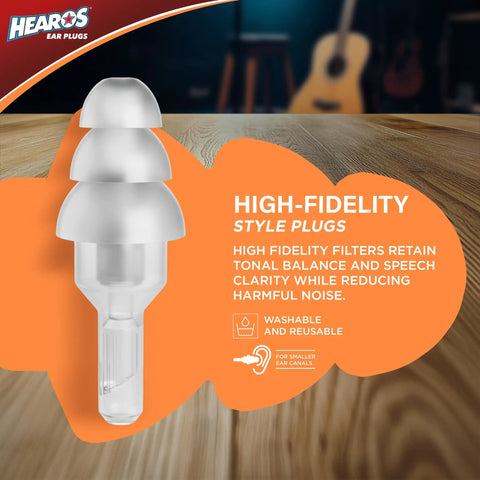 Flat Attenuation Ear Plugs For Music Lovers With Free Case NRR 12 Silicone Hypoallergenic Clear One Pair on wooden table.