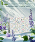 Two Large 13 Inch Floral Gift Bags With Matching Tissue Paper Card And Envelope Set Hand Painted Bloom Design Totally Perfect For Any Occasion Great For Women Gifts And Special Occasions, showcased with purple flowers.