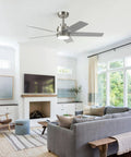 52 Inch Brushed Nickel Ceiling Fan With Integrated Light And Remote Serving Up Chill Breeze And Reversible Wood Blades For Living Rooms Or Patios hanging in a modern living room.