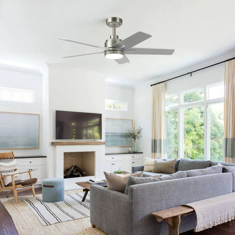 52 Inch Brushed Nickel Ceiling Fan With Integrated Light And Remote Serving Up Chill Breeze And Reversible Wood Blades For Living Rooms Or Patios hanging in a modern living room.