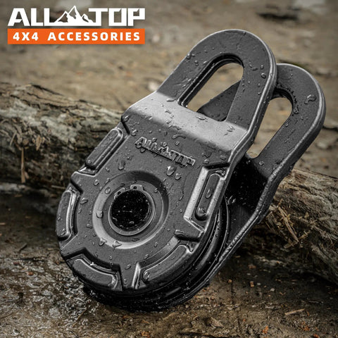 Forged Snatch Block 18 Ton Extreme Recovery Winch Pulley For Synthetic Rope Or Steel Cable Beefy Fully Forged Steel Construction With 79,300 Lbs Break Strength And 12 Stage E Coated Finish, black forged pulley on muddy log