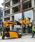 Slick Electric Vacuum Suction Cup Cart Built For No Sweat Heavy Glass And Stone Lifting With Extendable Telescopic Arm Automatic Robotic Handler in use at construction site.