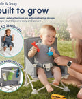 Baby using OmniBoost Travel Booster Seat With Tray For Baby On The Go Portable Folding Booster outdoors with parent
