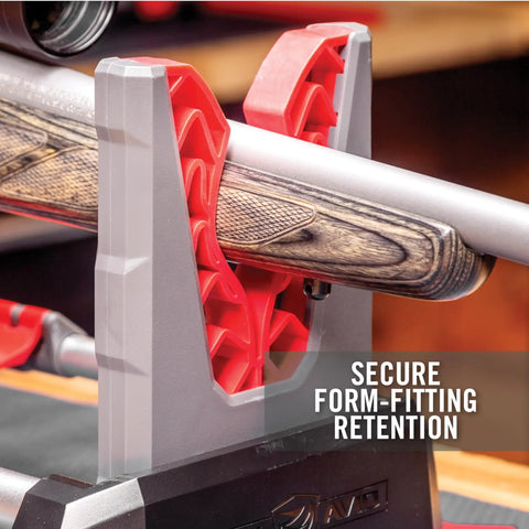 Speed Stand Collapsible Gun Vise holding rifle securely with dual angled grips