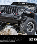 Beefy Superlift Radius Arms For Ford F 250 And F 350 Super Duty 4WD With 2 To 8 Inch Lift High Clearance Heavy Duty Off Road Ready Upgrade Includes Installed Bushings And EC Coat Finish. Black Jeep off-road front suspension and tires.