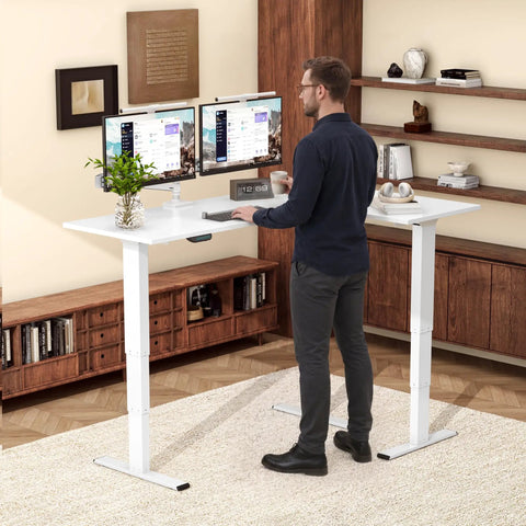 Rock Solid White L Shaped Electric Standing Desk Equipped With Triple Motor Height Adjustment For A Fully Ergonomic Home Office Setup with dual monitors.
