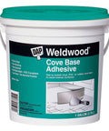 Weld Wood Cove Base Adhesive 1 Gallon Off White bucket with label instructions for woodworking projects and installations.