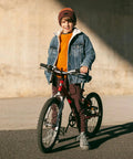 Child standing with bike fitted with Heavy Duty Inner Tube Fits 20x1.75 To 2.25 For Road, Mountain And City Bikes With Schrader Valve AV32mm