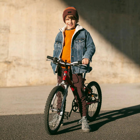 Child standing with bike fitted with Heavy Duty Inner Tube Fits 20x1.75 To 2.25 For Road, Mountain And City Bikes With Schrader Valve AV32mm