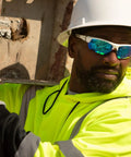 Worker wearing Ridgeline Full Brim Hard Hat With 4 Point Ratchet Fit Ultra Lightweight ABS Safety Helmet Ventilated White on site
