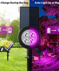 Purple Solar LED Spotlight 2 Pack Outdoor Waterproof Landscape Lights with auto charge and light up visuals, day to night usage.
