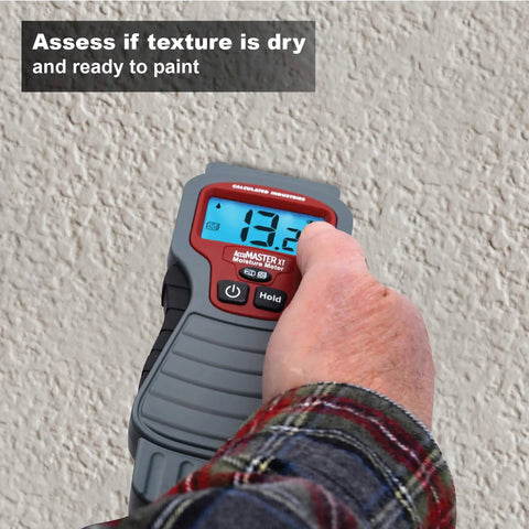 Person using 7440 AccuMASTER XT Digital Moisture Meter Handheld Pin Type with Backlit LCD on textured wall
