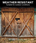 Rock Solid Five Inch Black Stainless Steel Padlock Hasp Door Latch Lock on weathered wooden doors for outdoor use.