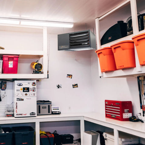 Ceiling Mounted Forced Air Unit Heater With 50000 Btu Dual Fuel Propane Natural Gas For Garages Workshops Kicks Serious Heat Up To 1667 Sq Ft Low Profile Design installed in a garage.