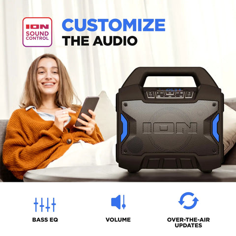 Tailgater Boom Outdoor Portable Bluetooth Speaker With Mic In FM Radio USB Port Battery IPX5 Water Resistant Wireless Stereo Link App Control 60W Peak Power for parties shown on table near person