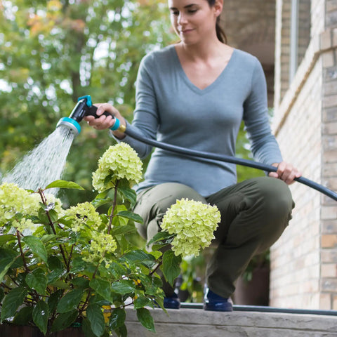 Flexogen 5/8 Inch X 50 Ft Garden Hose Heavy Duty Water Hose Built To Last in use for watering garden flowers