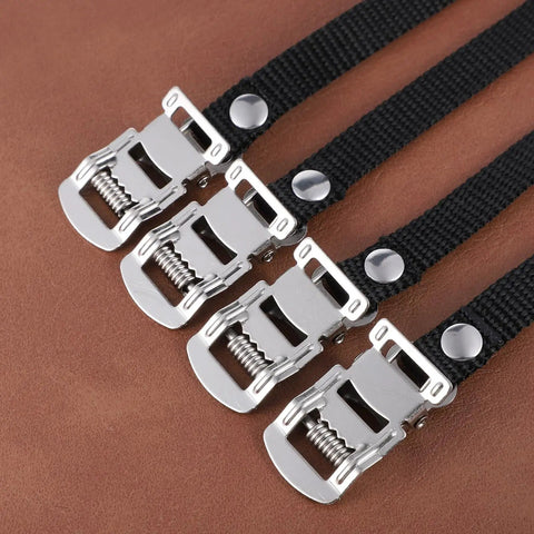 2 Pair Bike Pedal Straps For Universal Replacement Foot Pedal Straps With Toe Clips, black nylon and metal buckles on brown background