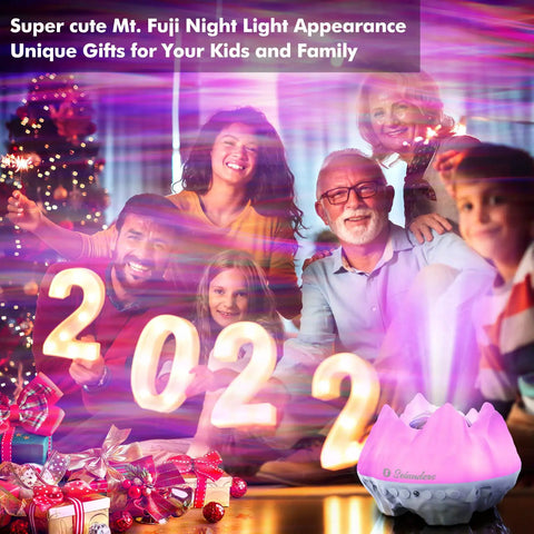 Family celebrating New Year with 4 In 1 Northern Lights Aurora Projector With Bluetooth Speaker And White Noise Machine Galaxy Starry Sky Night Light