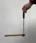 Hand holding 41 Inch Magnetic Pickup Tool With 35 Pound Suction lifting hammer
