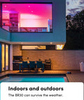 Outdoor patio with pink-lit windows showcasing Wi-Fi Smart Infrared BR30 LED Bulb With 1100 Lumens, Billions Of Colors And Whites