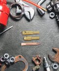 Pro Grade Car Dent Remover Chuck Kit For Auto Body Repair with weld rod chuck, soldering tips, and assorted metal tools on surface
