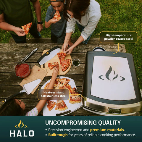 Versa 16 Pizza Oven with 16 Inch Rotating Stone in outdoor setting, showing stainless steel build and cooking pizza slices.
