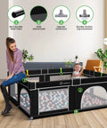 Big Baby Playpen 71x59 Inch With Gate, sturdy mesh, indoor toddler play pen activity center, shown with woman and baby inside.