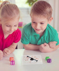 Children using Clear Classroom Spinners 10 Pack With Rotating Arrows For Dry Erase Math Games, 4x4 inch plastic spinner on table.