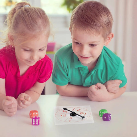 Children using Clear Classroom Spinners 10 Pack With Rotating Arrows For Dry Erase Math Games, 4x4 inch plastic spinner on table.
