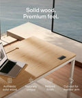 Rock Solid Electric Standing Desk Gliding Smoothly On Ultra Quiet Quad Motors Sixty Three Inch Worktop with solid wood surface.