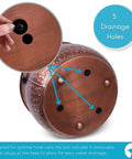 Copper water hose holder pot base showing 3 drainage holes with rubber plugs for Water Hose Holder With Lid Ground Garden Hose Pot For Indoor And Outdoor Use Copper Accents Steel Construction With Handle Decorates Patio Or Deck Keeps Hose Neat Protected And Ready To Go.
