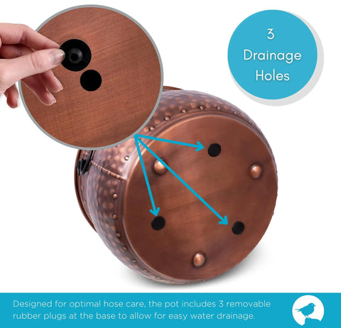 Copper water hose holder pot base showing 3 drainage holes with rubber plugs for Water Hose Holder With Lid Ground Garden Hose Pot For Indoor And Outdoor Use Copper Accents Steel Construction With Handle Decorates Patio Or Deck Keeps Hose Neat Protected And Ready To Go.
