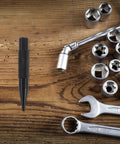 Tough As Nails Auto Body Hammer And Car Dent Repair Pen For Quick Panel Fixes Effortlessly Smoothing Sheet Metal Dings On Your Daily Driver Rig With Durable Steel Build Black on a wooden surface.