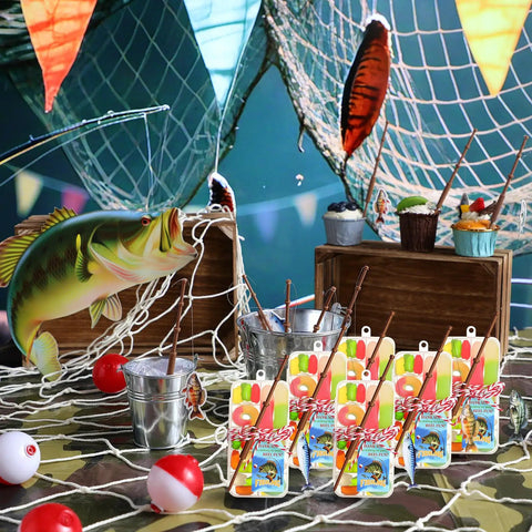 Gone Fishing Party Favors Kit with 12 candy tackle boxes, mini fishing rods, red white floats, and thank you cards on display table.