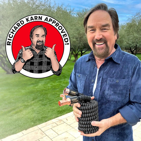 50 Foot Expandable Garden Hose Featuring Tough Copper Blend Core And Adjustable 10 Spray Pattern Dial held by a smiling man outdoors.