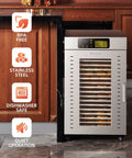 Heavy Duty Commercial Food Dehydrator With Eighteen Stackable Trays, A Hardcore Two Thousand Watt Heater, And All Stainless Steel Build displayed in a kitchen setting.