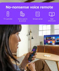 User holding no-nonsense voice remote with Sleek 32 Inch Full H d Smart Television in background, ideal for easy streaming.